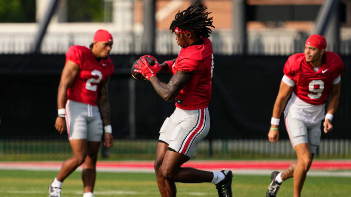 Aug 8, 2024; Columbus, Ohio, USA; Ohio State Buckeyes wide receiver Jeremiah Smith (4) catches a pass during football practice at the Woody Hayes Athletic Complex.