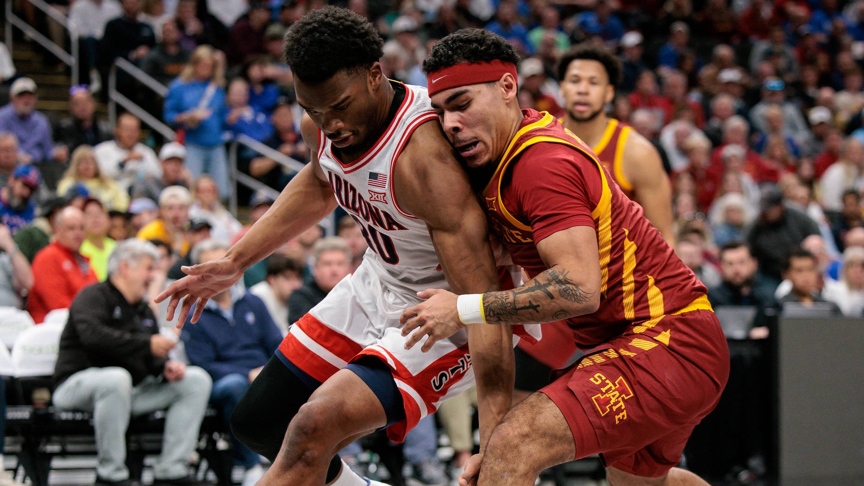 Mar 13, 2026; Kansas City, MO, USA; Iowa State Cyclones forward Joshua Jefferson (5) collides with Arizona Wildcats forward Tobe Awaka (30) during the second half at T-Mobile Center. Mandatory Credit: William Purnell-Imagn Images | IMAGN IMAGES via Reuters Connect