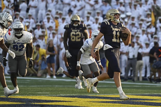 Navy quarterback Blake Horvath scores a touchdown against the Memphis Tigers.