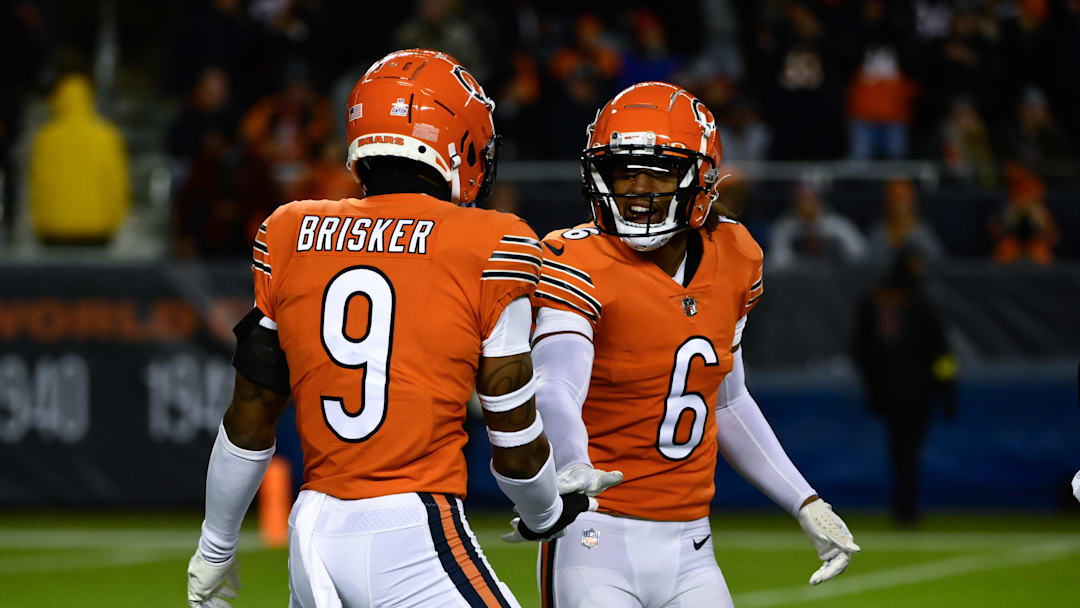 Oct 13, 2022; Chicago, Illinois, USA; Chicago Bears safety Jaquan Brisker (9) and Chicago Bears cornerback Kyler Gordon (6) after Brisker sacked Washington Commanders quarterback Carson Wentz (11) during the first half at Soldier Field. Mandatory Credit: Matt Marton-Imagn Images