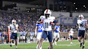 Nov 15, 2025; Durham, North Carolina, USA;  Virginia Cavaliers wide receiver Trell Harris (11) celebrates a touchdown against the Duke Blue Devils in the third quarter at Wallace Wade Stadium. Mandatory Credit: Zachary Taft-Imagn Images