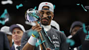 Feb 9, 2025; New Orleans, LA, USA; Philadelphia Eagles quarterback Jalen Hurts holds the Lombardi Trophy during the championship trophy presentation after the Eagles' game against the Kansas City Chiefs in Super Bowl LIX at Caesars Superdome. Mandatory Credit: Geoff Burke-Imagn Images