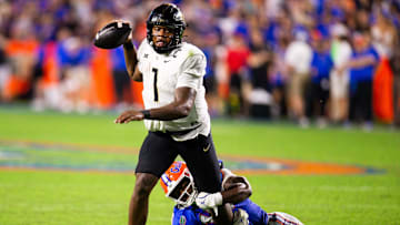 UCF Knights quarterback KJ Jefferson (1) is sacked by Florida Gators linebacker Grayson Howard (10) during the second half at Ben Hill Griffin Stadium in Gainesville, FL on Saturday, October 5, 2024. [Doug Engle/Gainesville Sun]