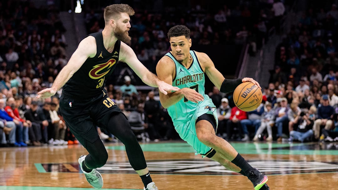 Charlotte Hornets guard Josh Green drives on Cleveland Cavaliers forward Dean Wade during the second quarter at Spectrum Center. 
