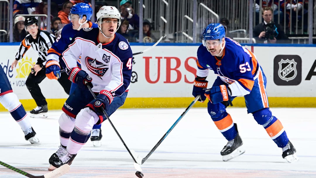 Blue Jackets center Cole Sillinger looks to make a play with the puck against the New York Islanders.