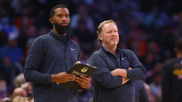 Milwaukee Bucks head coach Mike Budenholzer (right) and assistant coach Charles Lee against the Phoenix Suns