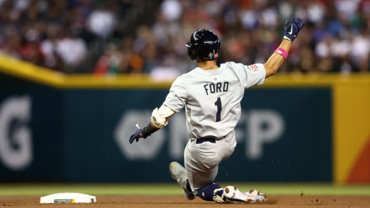 Great Britain catcher Harry Ford slides into second base with a double in the second inning against Mexico during the World Baseball Classic at Chase Field in 2023.