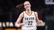 Indiana Fever guard Caitlin Clark reacts after a basket against the Atlanta Dream.