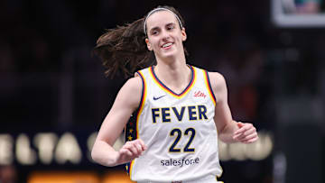 Indiana Fever guard Caitlin Clark reacts after a basket against the Atlanta Dream.
