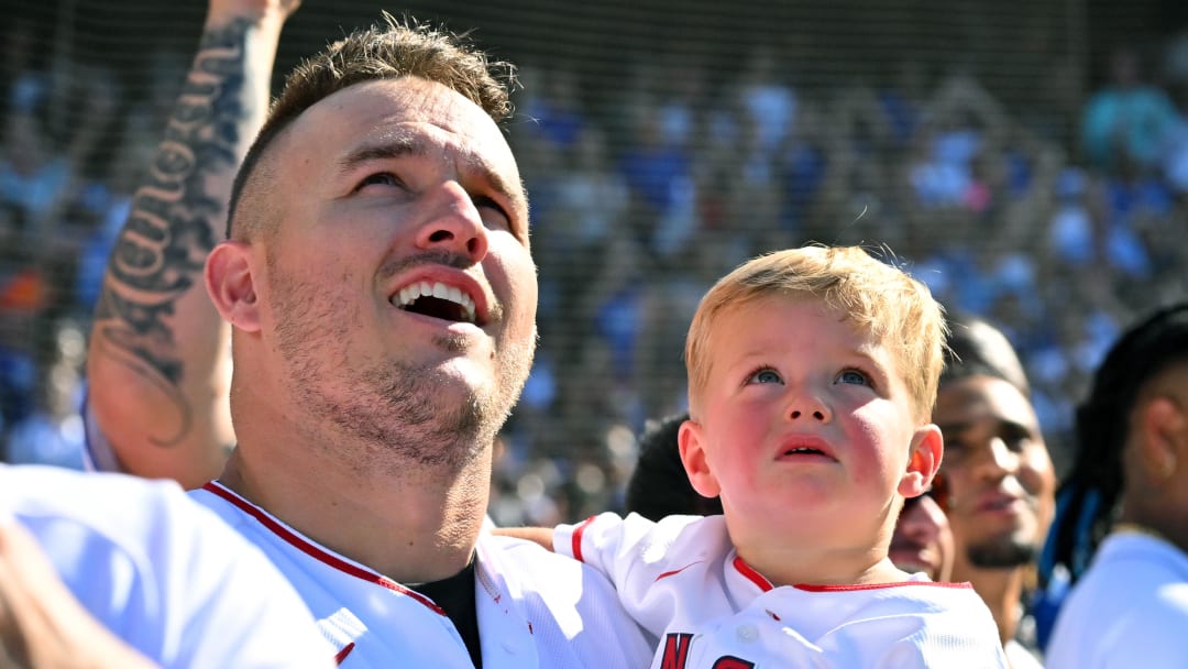 Jul 18, 2022; Los Angeles, CA, USA; Los Angeles Angels center fielder Mike Trout (27) and his son Beckham Trout watch the flyover before the 2022 Home Run Derby at Dodgers Stadium. Mandatory Credit: Jayne Kamin-Oncea-USA TODAY Sports