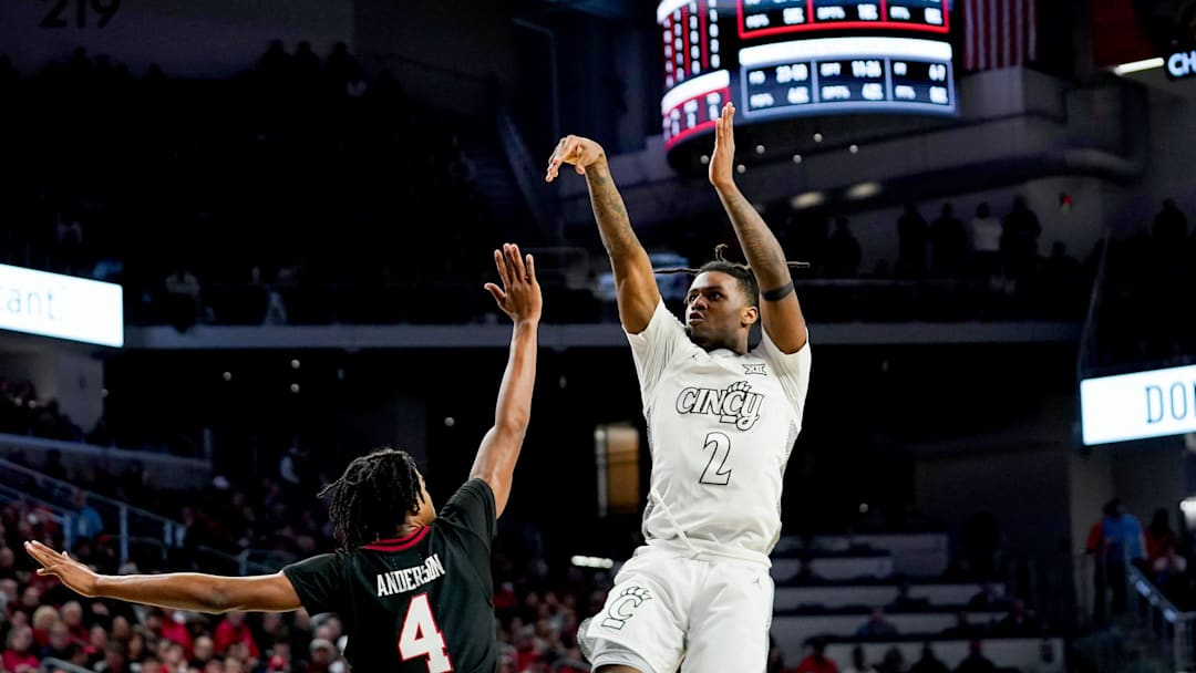 Cincinnati Bearcats guard Jizzle James (2) hits a basket in the second half of a NCAA men’s basketball game between the Cincinnati Bearcats and Texas Tech Red Raiders, Tuesday, Jan. 21, 2025, at Fifth Third Arena in Cincinnati. Red Raiders won 81-71. Cincinnati Bearcats guard Jizzle James (2) hits a basket in the second half of a NCAA men’s basketball game between the Cincinnati Bearcats and Texas Tech Red Raiders, Tuesday, Jan. 21, 2025, at Fifth Third Arena in Cincinnati. Red Raiders won 81-71.