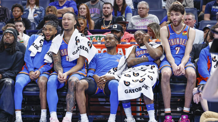 Apr 10, 2024; Oklahoma City, Oklahoma, USA; (L-R) Oklahoma City Thunder guard Isaiah Joe (11) and forward Jaylin Williams (6) and guard Shai Gilgeous-Alexander (2) and forward Jalen Williams (8) and forward Chet Holmgren (7) watch their team play against the San Antonio Spurs during the second half at Paycom Center. Mandatory Credit: Alonzo Adams-USA TODAY Sports