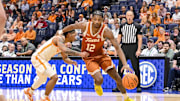 Mar 14, 2025; Nashville, TN, USA;  Texas Longhorns guard Tramon Mark (12) drives to the basket past Tennessee Volunteers guard Chaz Lanier (2) during the second half at Bridgestone Arena. Mandatory Credit: Steve Roberts-Imagn Images