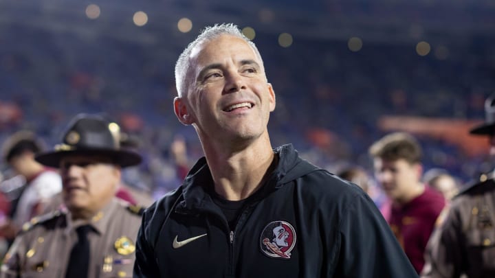 Florida State Seminoles head coach Mike Norvell smiles to the crowd after the game against the Florida Gators at Steve Spurrier Field at Ben Hill Griffin Stadium in Gainesville, FL on Saturday, November 25, 2023. [Matt Pendleton/Gainesville Sun]