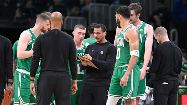 Apr 5, 2024; Boston, Massachusetts, USA; Boston Celtics head coach Joe Mazzulla works with the team during a timeout.