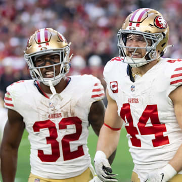 Jan 5, 2025; Glendale, Arizona, USA; San Francisco 49ers running back Patrick Taylor Jr. (32) and fullback Kyle Juszczyk (44) celebrate a touchdown against the Arizona Cardinals at State Farm Stadium. Mandatory Credit: Mark J. Rebilas-Imagn Images