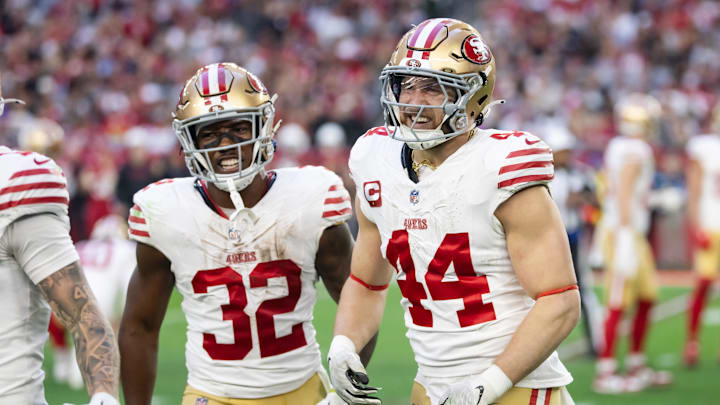 Jan 5, 2025; Glendale, Arizona, USA; San Francisco 49ers running back Patrick Taylor Jr. (32) and fullback Kyle Juszczyk (44) celebrate a touchdown against the Arizona Cardinals at State Farm Stadium. Mandatory Credit: Mark J. Rebilas-Imagn Images