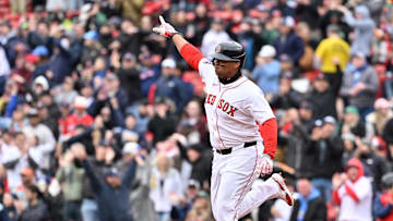 Apr 6, 2025; Boston, Massachusetts, USA; Boston Red Sox designated hitter Rafael Devers (11) reacts to hitting a home run against the St. Louis Cardinals during the fifth inning at Fenway Park. Mandatory Credit: Eric Canha-Imagn Images
