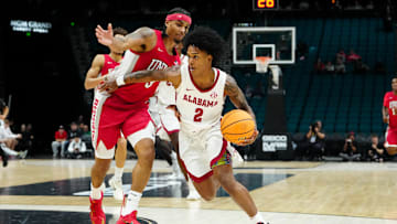 Nov 25, 2025; Las Vegas, Nevada, USA; Alabama Crimson Tide guard Aden Holloway (2) drives the ball in the first half against UNLV Rebels in a 2025 Players Era Festival group play game at MGM Grand Garden Arena. Mandatory Credit: Stephen R. Sylvanie-Imagn Images