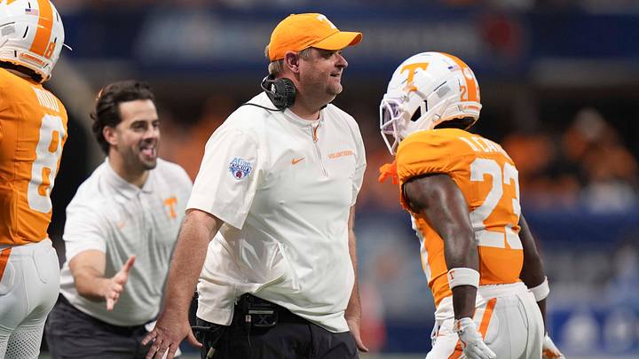 Tennessee head coach Josh Heupel celebrates on the sideline with defensive back Boo Carter (23) during the Aflac Kickoff Game between the Volunteers and Syracuse held at Mercedes-Benz Stadium in Atlanta, Ga., on August 30, 2025.