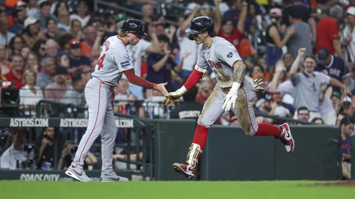 Aug 20, 2024; Houston, Texas, USA; Boston Red Sox center fielder Jarren Duran (16) celebrates with third base coach Kyle Hudson (84) after hitting a home run during the eighth inning against the Houston Astros at Minute Maid Park. Mandatory Credit: Troy Taormina-USA TODAY Sports