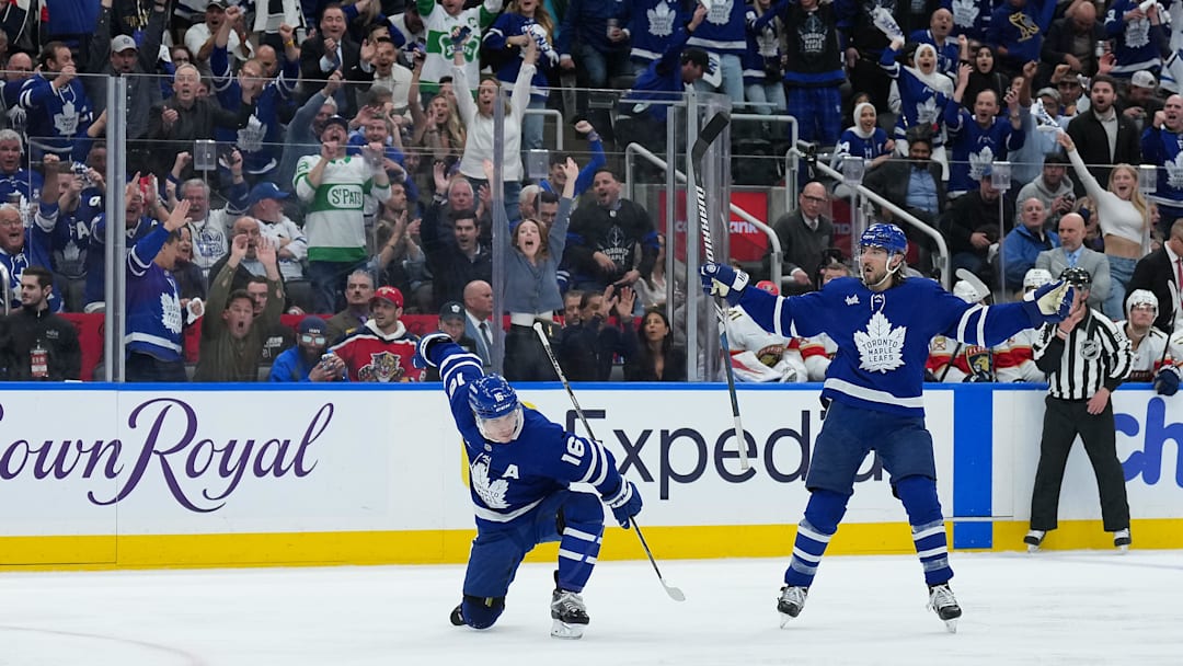 May 7, 2025; Toronto, Ontario, CAN; Toronto Maple Leafs right wing Mitch Marner (16) scores a goal and celebrates with defenseman Chris Tanev (8) against the Florida Panthers during the third period in game two of the second round of the 2025 Stanley Cup Playoffs at Scotiabank Arena. Mandatory Credit: Nick Turchiaro-Imagn Images