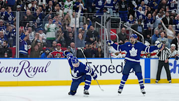 May 7, 2025; Toronto, Ontario, CAN; Toronto Maple Leafs right wing Mitch Marner (16) scores a goal and celebrates with defenseman Chris Tanev (8) against the Florida Panthers during the third period in game two of the second round of the 2025 Stanley Cup Playoffs at Scotiabank Arena. Mandatory Credit: Nick Turchiaro-Imagn Images