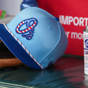 Jul 4, 2025; Atlanta, Georgia, USA; A detailed view of the Baltimore Orioles 4th of July hat in the dugout against the Atlanta Braves in the third inning at Truist Park. 