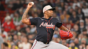 May 16, 2025; Boston, Massachusetts, USA; Atlanta Braves relief pitcher Raisel Iglesias (26) throws against the Boston Red Sox during the ninth inning at Fenway Park. Mandatory Credit: Eric Canha-Imagn Images