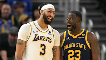 Jan 27, 2024; San Francisco, California, USA; Los Angeles Lakers forward Anthony Davis (3) and Golden State Warriors forward Draymond Green (23) talk during the third quarter at Chase Center. Mandatory Credit: Darren Yamashita-Imagn Images