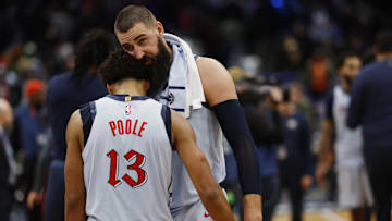 Dec 7, 2024; Washington, District of Columbia, USA; Washington Wizards guard Jordan Poole (13) celebrates with Wizards center Jonas Valanciunas (R) after their game against the Denver Nuggets at Capital One Arena. Mandatory Credit: Geoff Burke-Imagn Images