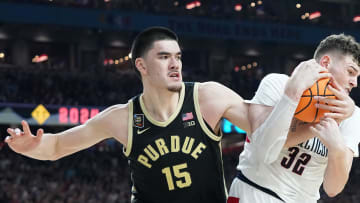 Purdue Boilermakers center Zach Edey (15) and Connecticut Huskies center Donovan Clingan (32) fight for a rebound during the NCAA Men’s Basketball Tournament Championship, Monday, April 8, 2024, at State Farm Stadium in Glendale, Ariz.