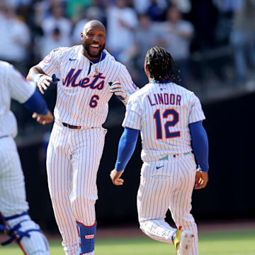 New York Mets designated hitter Starling Marte (6) celebrates his walkoff RBI single against the Philadelphia Phillies with catcher Luis Torrens (13) and shortstop Francisco Lindor (12) during the tenth inning at Citi Field on April 23.