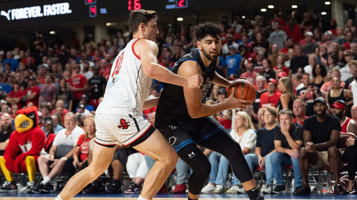 La Familia's Kerem Kanter (35) makes his way around The Ville's Nick Mayo (10) during their game on Monday, July 29, 2024 at Freedom Hall in Louisville, Ky. during the quarter finals of The Basketball Tournament.