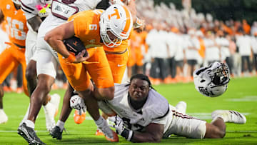 Tennessee quarterback Joey Aguilar (6) fights his way to the end zone for a touchdown to tie the game in the final minutes of regulation during a college football game between Tennessee and Mississippi State at Davis Wade Stadium in Starkville, Miss., on Sept. 27, 2025.