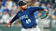 Aug 14, 2023; Kansas City, Missouri, USA; Seattle Mariners relief pitcher Isaiah Campbell (49) pitches during the seventh inning against the Kansas City Royals at Kauffman Stadium. Mandatory Credit: Jay Biggerstaff-Imagn Images