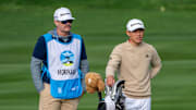 February 2, 2025; Pebble Beach, California, USA; Collin Morikawa (right) and caddie JJ Jakovac (left) on the second hole during the final round of the AT&T Pebble Beach Pro-Am golf tournament at Pebble Beach Golf Links. Mandatory Credit: Kyle Terada-Imagn Images