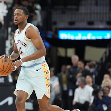 Mar 12, 2025; San Antonio, Texas, USA; San Antonio Spurs guard De'Aaron Fox (4) dribbles up the court in the first half against the Dallas Mavericks at Frost Bank Center.