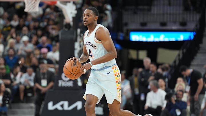 Mar 12, 2025; San Antonio, Texas, USA; San Antonio Spurs guard De'Aaron Fox (4) dribbles up the court in the first half against the Dallas Mavericks at Frost Bank Center. Mar 12, 2025; San Antonio, Texas, USA; San Antonio Spurs guard De'Aaron Fox (4) dribbles up the court in the first half against the Dallas Mavericks at Frost Bank Center.