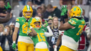 Jan 1, 2024; Glendale, AZ, USA; Oregon Ducks wide receiver Tez Johnson (15) celebrates with offensive lineman Steven Jones (74) and tight end Patrick Herbert (88) after scoring a touchdown against the Liberty Flames during the second half in the 2024 Fiesta Bowl at State Farm Stadium. Mandatory Credit: Mark J. Rebilas-USA TODAY Sports