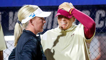 OU coach Patty Gasso and FSU coach Lonni Alameda talk after OU won the Women's College World Series