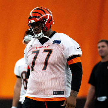 Cincinnati Bengals offensive tackle Trent Brown (77) walks to the line for field goal practice at Bengals spring practice at the IEL Indoor Facility in Cincinnati on Wednesday, June 12, 2024.