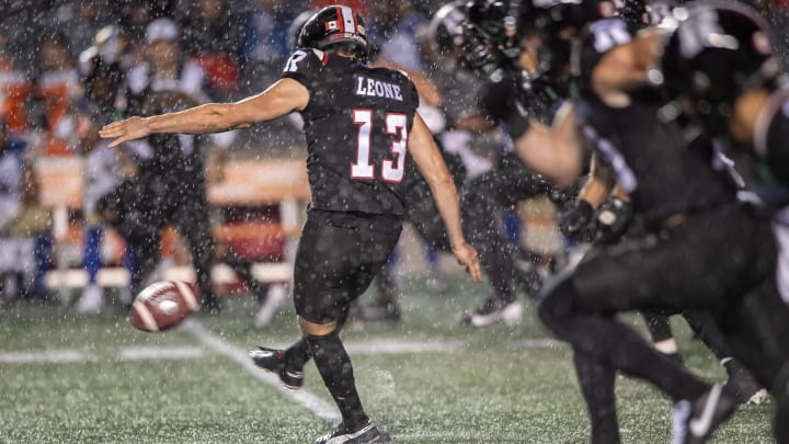 Jun 13, 2024; Ottawa, Ontario, CAN; Ottawa REDBLACKS kicker Richie Leone (13) kicks the ball in a rain soaked second half against the Winnipeg Blue Bombers at TD Place. Mandatory Credit: Marc DesRosiers-USA TODAY Sports