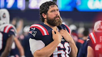 August 8, 2024; Foxborough, MA, USA;  New England Patriots center David Andrews (60) watches from the sideline during the first half against the Carolina Panthers at Gillette Stadium. Mandatory Credit: Eric Canha-Imagn Images