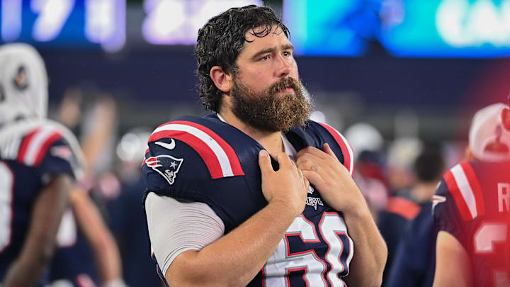 August 8, 2024; Foxborough, MA, USA;  New England Patriots center David Andrews (60) watches from the sideline during the first half against the Carolina Panthers at Gillette Stadium. Mandatory Credit: Eric Canha-Imagn Images