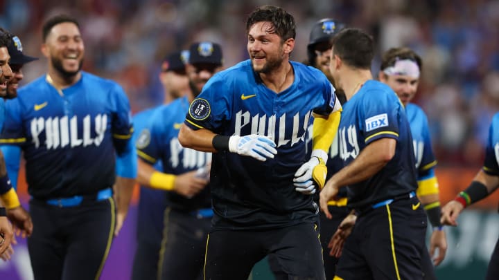 Aug 16, 2024; Philadelphia, Pennsylvania, USA; Philadelphia Phillies shortstop Trea Turner (7) celebrates with teammates after his walk off game winning RBI single during the ninth inning against the Washington Nationals at Citizens Bank Park.