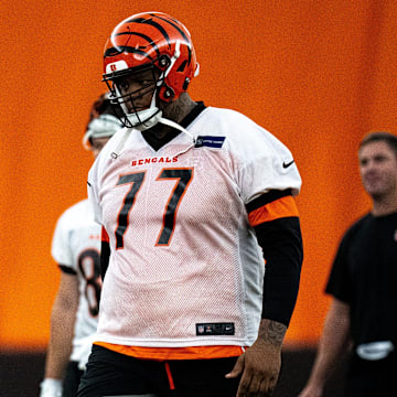 Cincinnati Bengals offensive tackle Trent Brown (77) walks to the line for field goal practice at Bengals spring practice at the IEL Indoor Facility in Cincinnati on Wednesday, June 12, 2024.