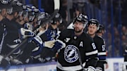 Mar 29, 2025; Tampa, Florida, USA; Tampa Bay Lightning right wing Nikita Kucherov (86) is congratulated by teammates after he scored a goal against the New York Islanders during the first period at Amalie Arena. Mandatory Credit: Kim Klement Neitzel-Imagn Images