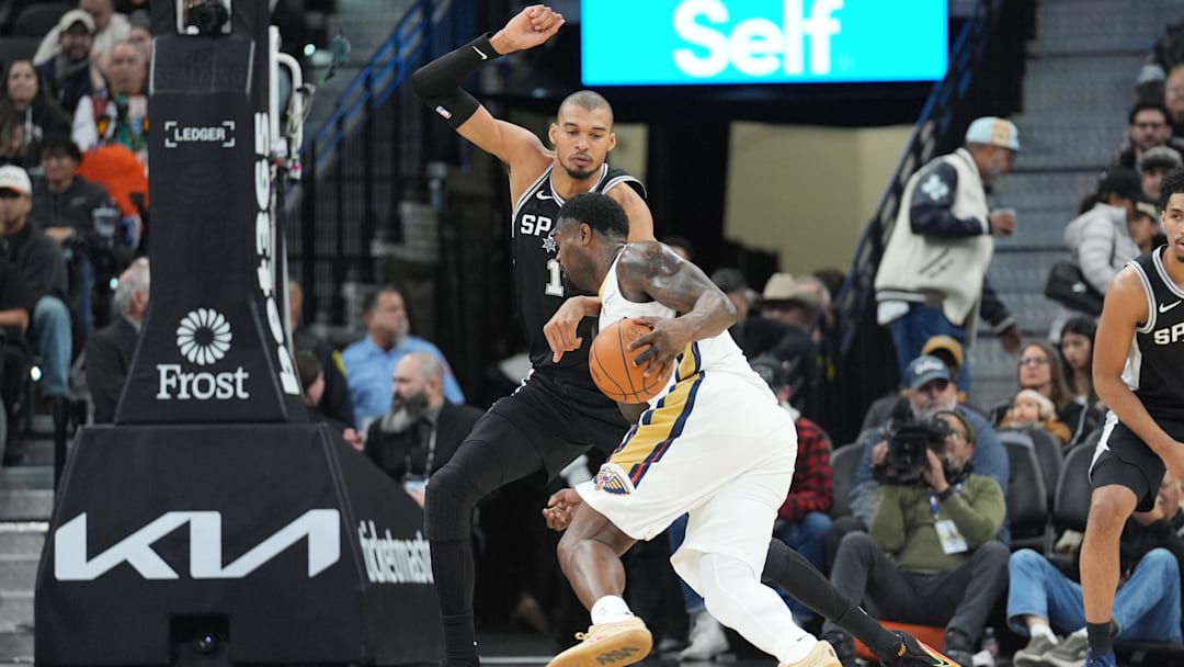 Jan 25, 2026; San Antonio, Texas, USA;  New Orleans Pelicans forward Zion Williamson (1) dribbles in against San Antonio Spurs forward Victor Wembanyama (1) in the first half at Frost Bank Center. Mandatory Credit: Daniel Dunn-Imagn Images