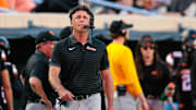 Sep 19, 2025; Stillwater, Oklahoma, USA; Oklahoma State Cowboys coach Mike Gundy on the sidelines during the first half against the Tulsa Golden Hurricane at Boone Pickens Stadium. Mandatory Credit: William Purnell-Imagn Images